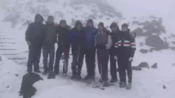The team on top of Snowden during training